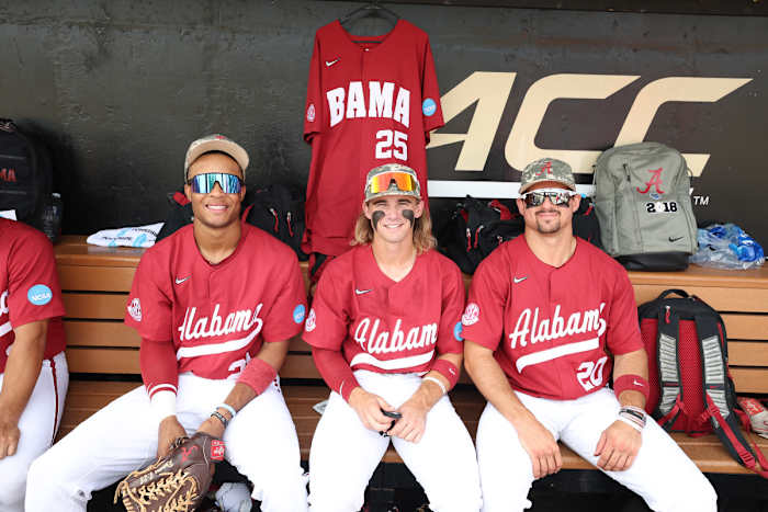 Alabama's Andrew Pinckney (21), Jim Jarvis (10), and Tommy Seidl (20) smiles for picture at David F. Couch Ballpark in Winston-Salem, N.C. on Sunday, June 11, 2023.
